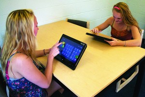 Sophomore behavioral analysis major Johanna Carlson (left), and Darien Steiner (right), freshman vet medicine major, explore their new twists.